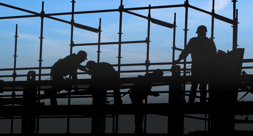 Workers on construction site representing infrastructure and building projects