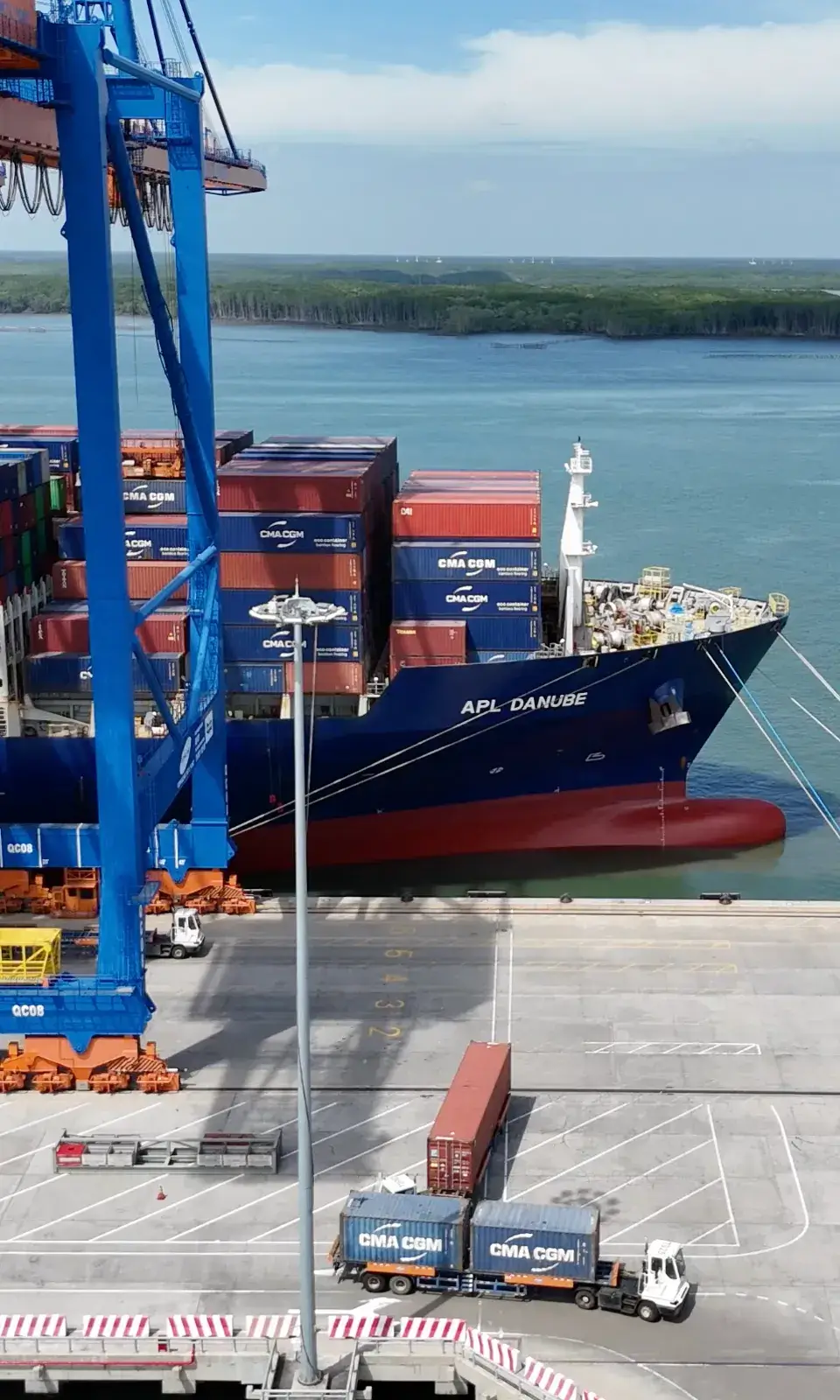Fully loaded cargo ship at port terminal for international container shipping and global logistics